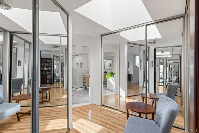 a living room with furniture and a glass door