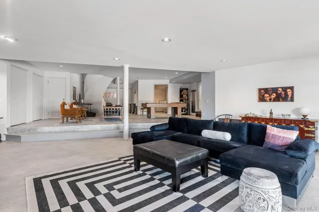 a living room with furniture and a rug