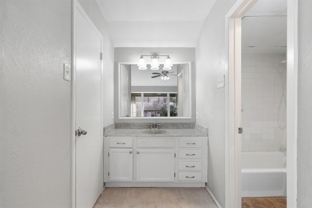4533 North O'Connor Road, Unit 2208 Irving, TX 75062 - Photo 23 of 28 a bathroom with a sink and a mirror