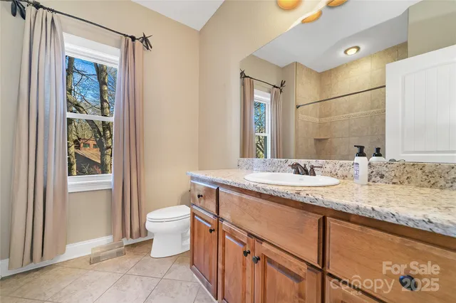 a bathroom with a toilet and a bathtub