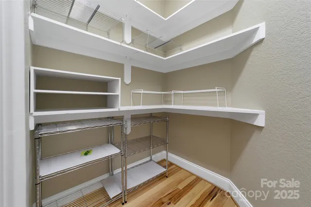 a living room with furniture a chandelier and a fireplace