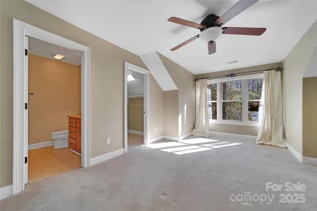 a bathroom with a granite countertop sink a mirror a vanity and shower