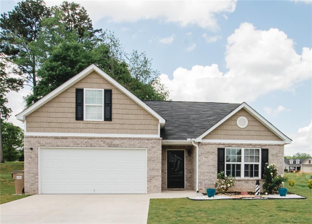 a front view of a house with yard
