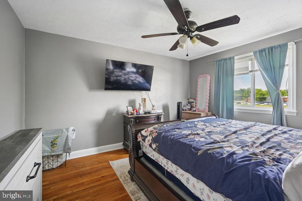 1918 Church Road Baltimore, MD 21222 - Photo 13 of 29 a bedroom with a bed and a flat screen tv