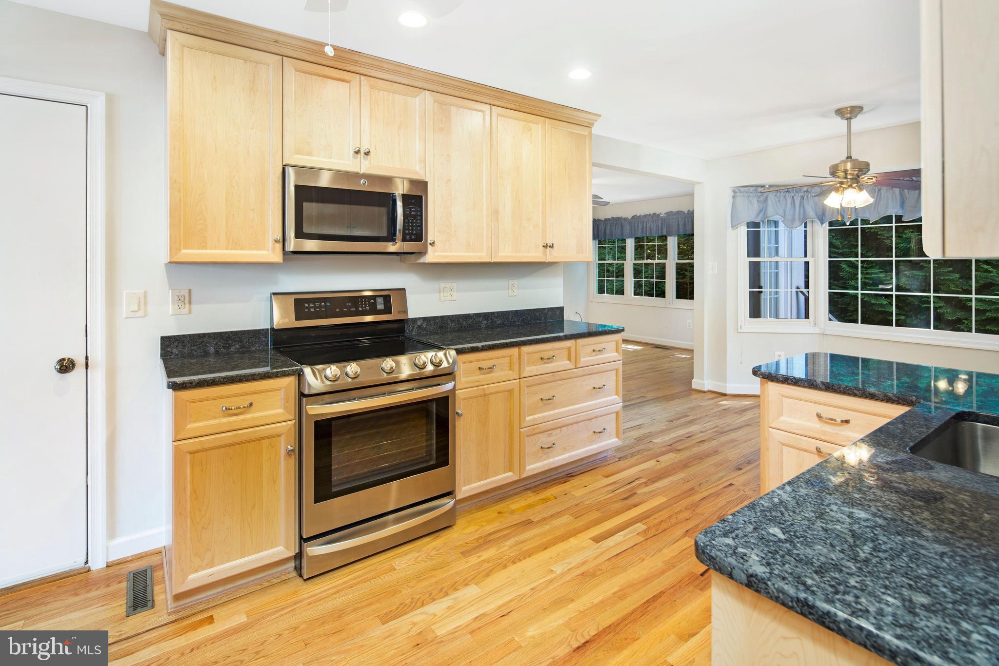 2437 Bear Den Road Frederick, MD 21701 - Photo 9 of 28 Renovated kitchen with granite and stainless