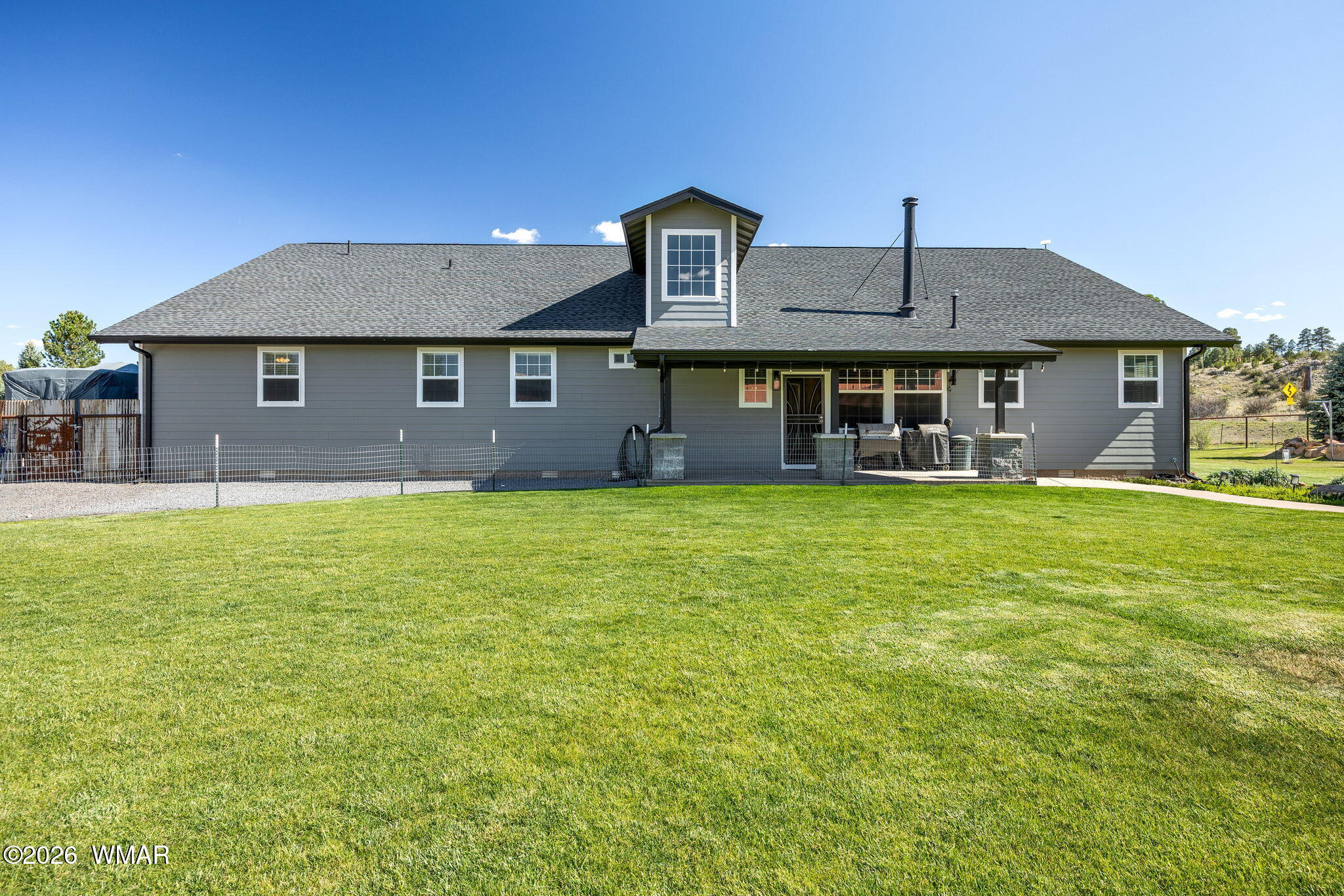 1940 Stonegate Way Heber, AZ 85928 - Photo 48 of 62 a front view of a house with garden
