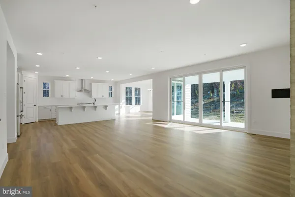 a view of a room that has a bed and a window
