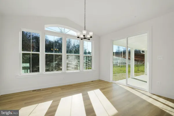 a kitchen with stainless steel appliances a refrigerator and a stove top oven