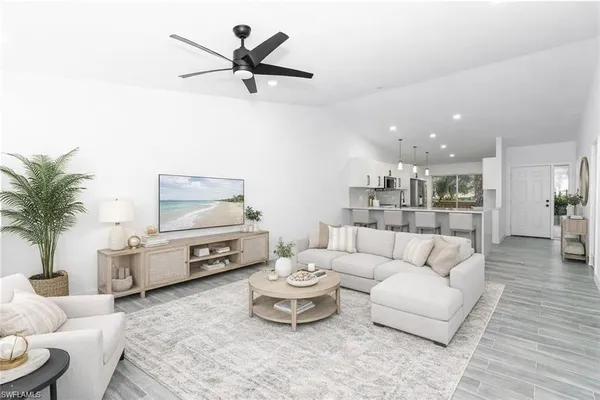 a living room with furniture and a large window