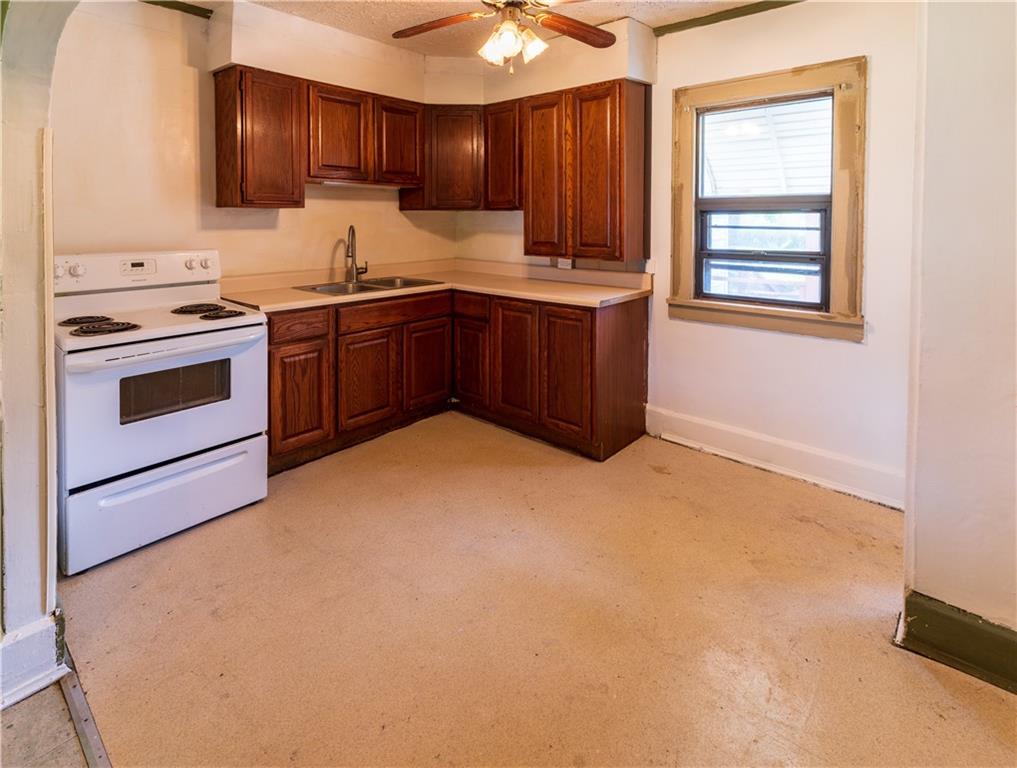 348 South Neshannock Road Hermitage, PA 16148 - Photo 2 of 15 a kitchen with stainless steel appliances a sink stove and cabinets