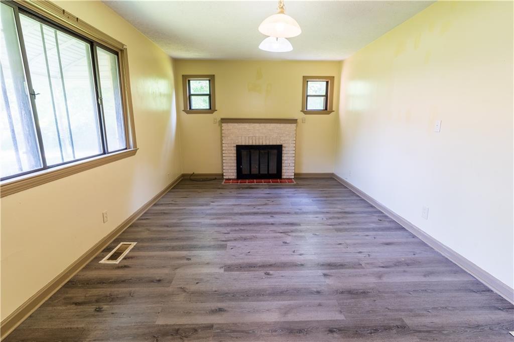 348 South Neshannock Road Hermitage, PA 16148 - Photo 3 of 15 a view of an empty room with wooden floor and a window