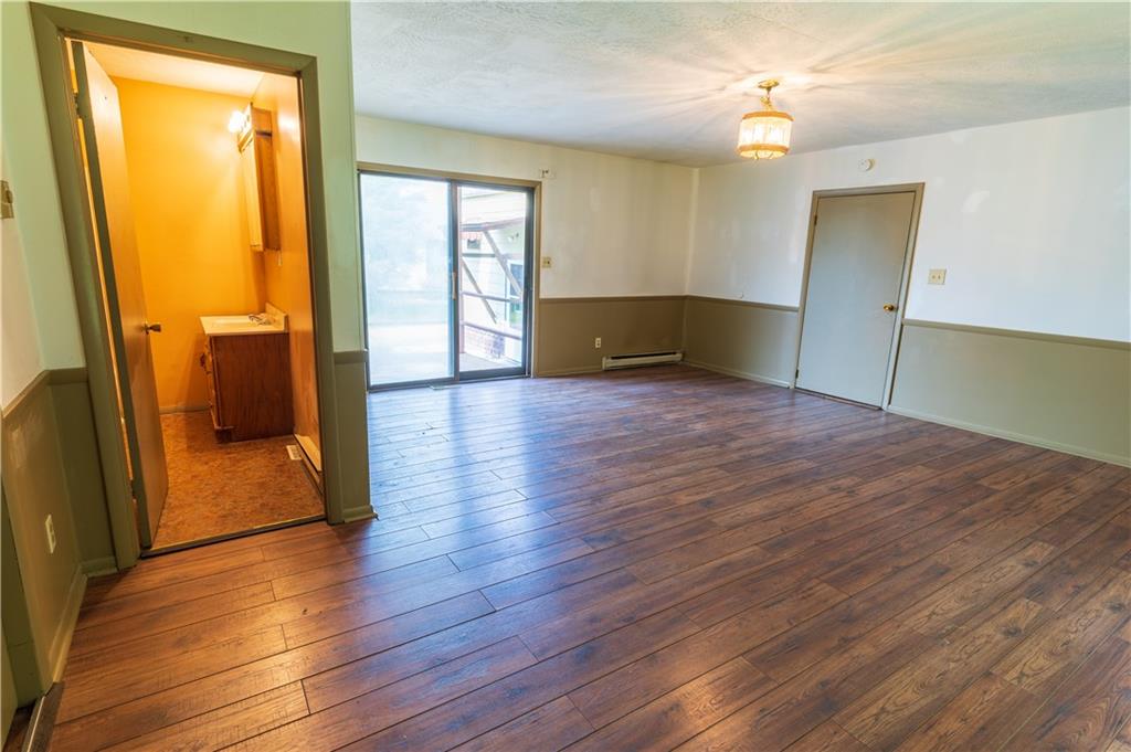 348 South Neshannock Road Hermitage, PA 16148 - Photo 4 of 15 a view of empty room with wooden floor and fan