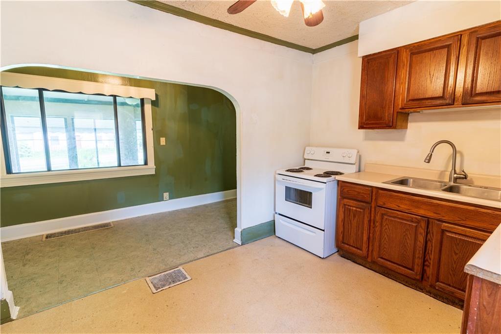 348 South Neshannock Road Hermitage, PA 16148 - Photo 5 of 15 a kitchen with stainless steel appliances granite countertop a stove a sink and a microwave