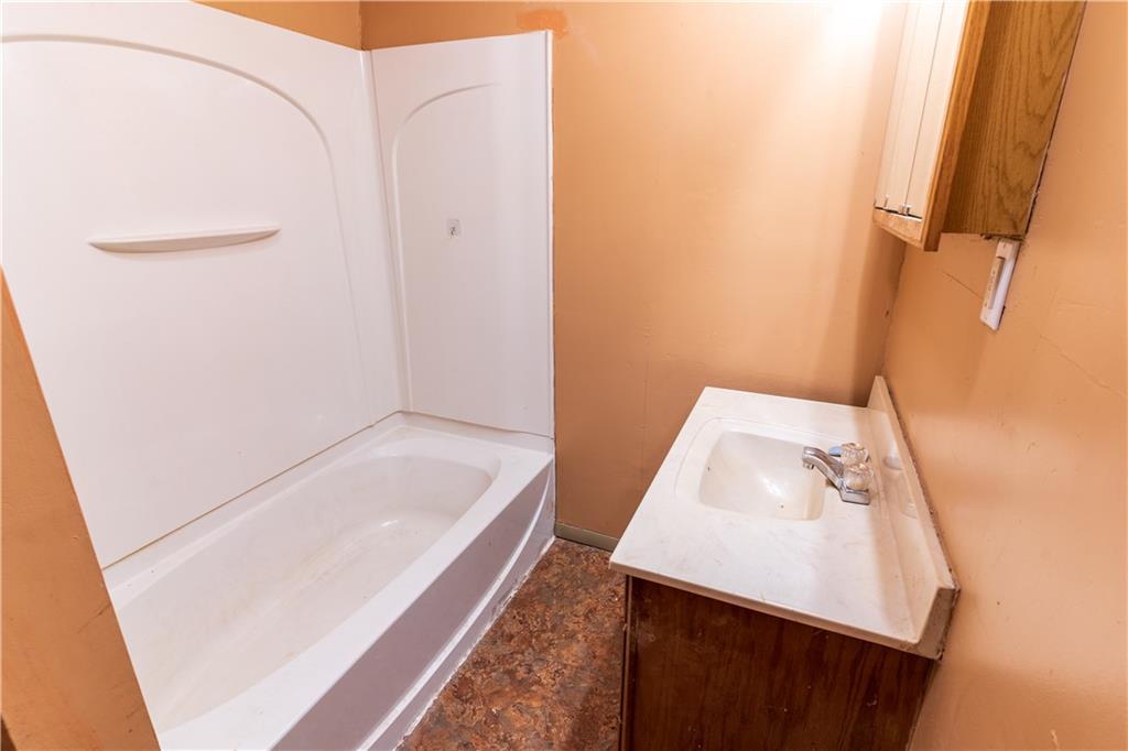 348 South Neshannock Road Hermitage, PA 16148 - Photo 7 of 15 a bathroom with a tub sink and vanity