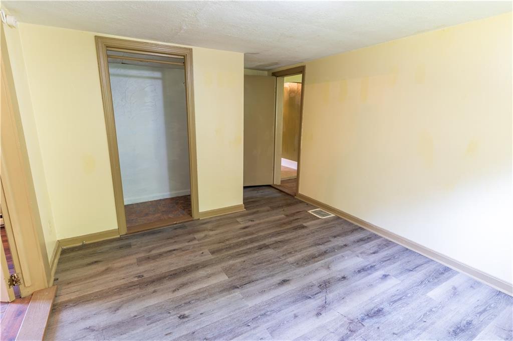 348 South Neshannock Road Hermitage, PA 16148 - Photo 9 of 15 a view of an empty room with wooden floor and closet
