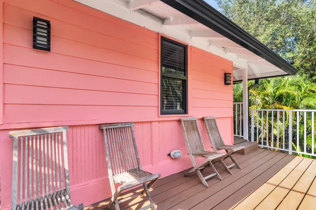 a view of a two chairs in the balcony