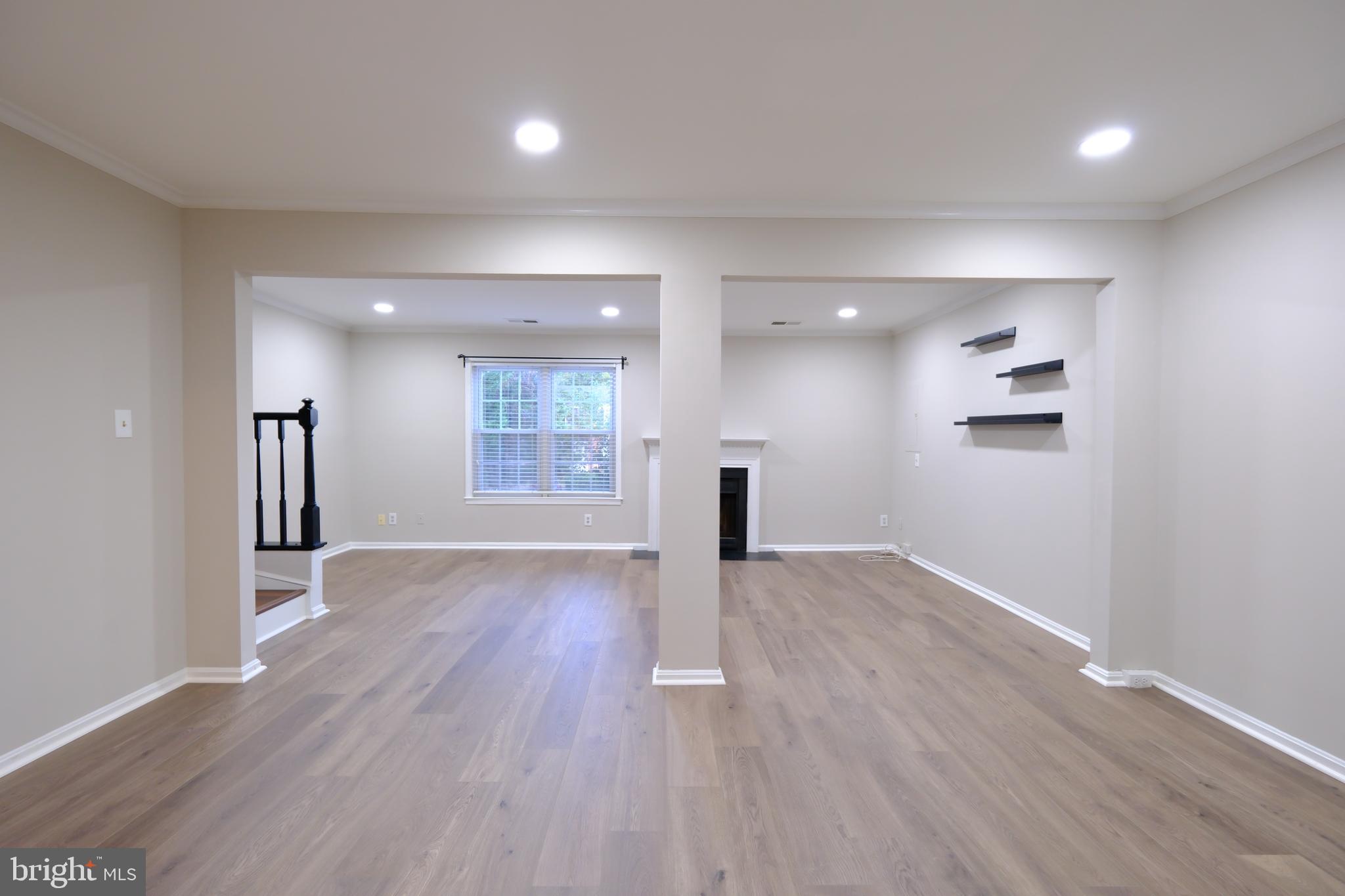 128 Bent Twig Lane, Unit 345 Gaithersburg, MD 20878 - Photo 7 of 17 wooden floor in an empty room with a window