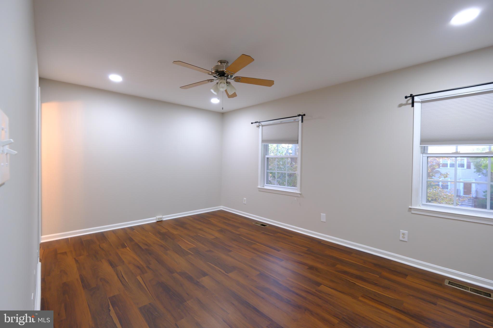128 Bent Twig Lane, Unit 345 Gaithersburg, MD 20878 - Photo 9 of 17 a view of empty room with wooden floor and fan