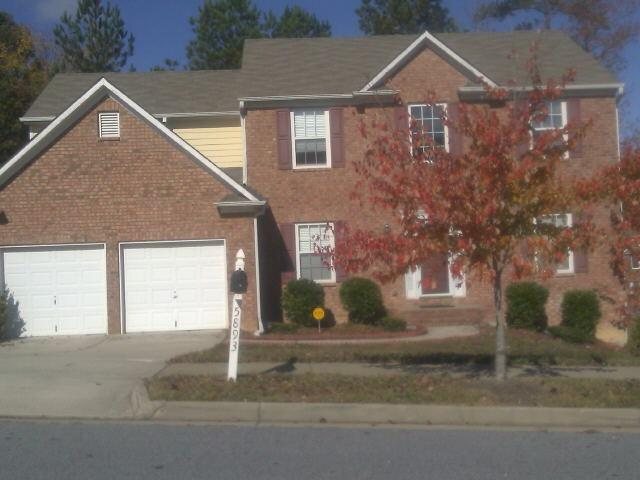 5893 Village Loop Fairburn, GA 30213 - Photo 1 of 1 a front view of a house with a yard