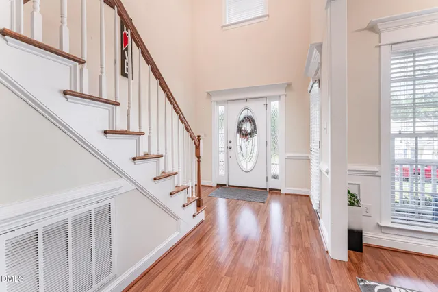 a view of entryway with wooden floor and window