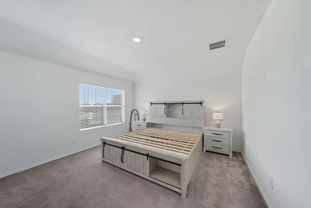 a bathroom with a sink a toilet and a large mirror