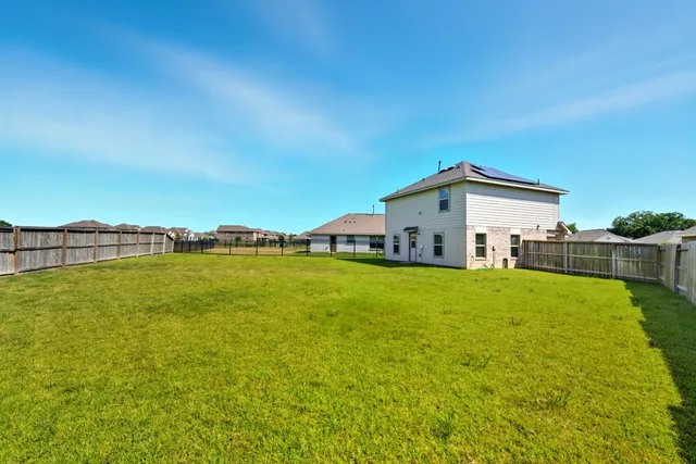 a view of a house with basketball court