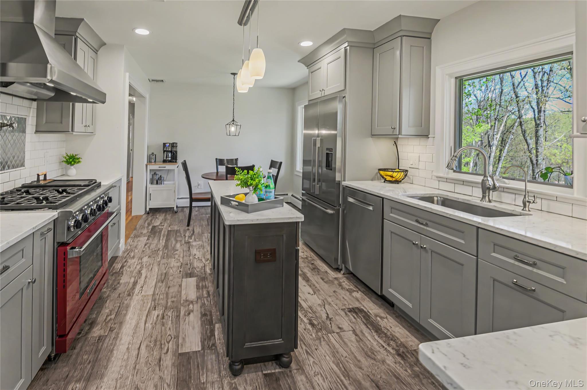 41 Cross Pond Road Pound Ridge, NY 10576 - Photo 11 of 41 a kitchen with stainless steel appliances granite countertop a stove a sink and a wooden cabinets