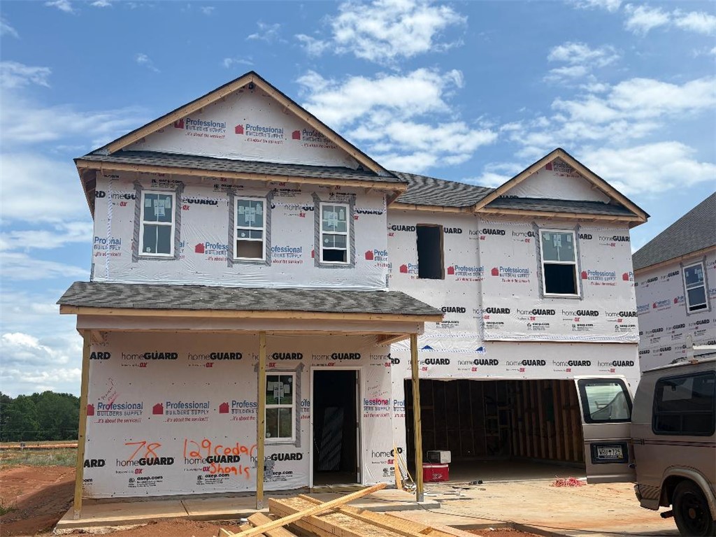 129 Cedar Shoals Easley, SC 29640 - Photo 1 of 8 This newly framed residence showcases a classic architectural design, awaiting its final finishes.