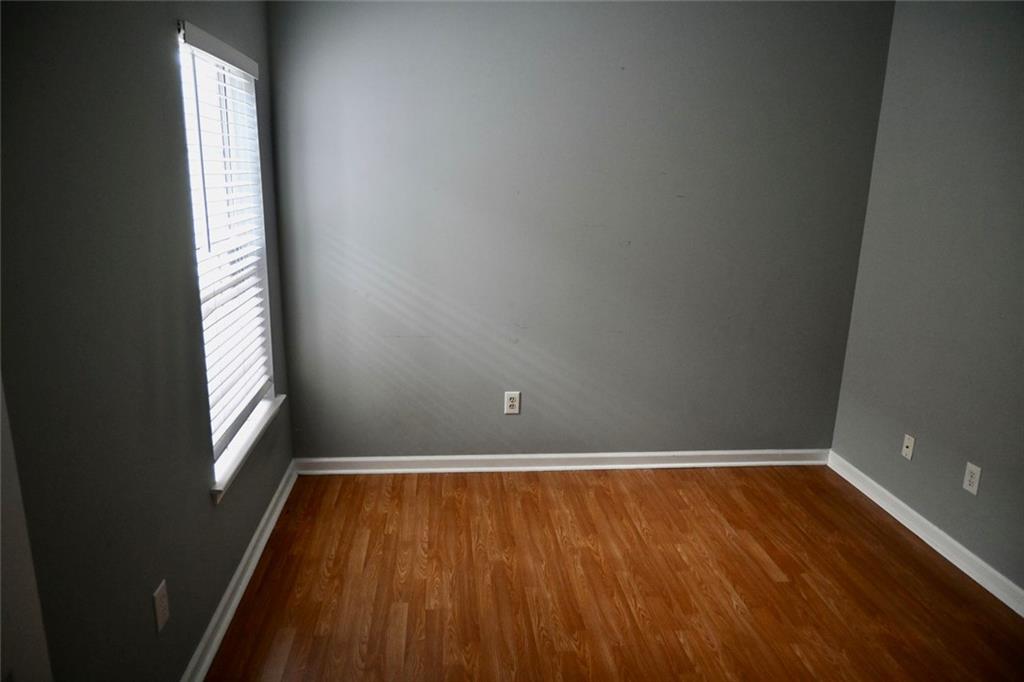 1563 Rachel's Ridge Northwest Kennesaw, GA 30152 - Photo 17 of 29 a view of a room with wooden floor and window