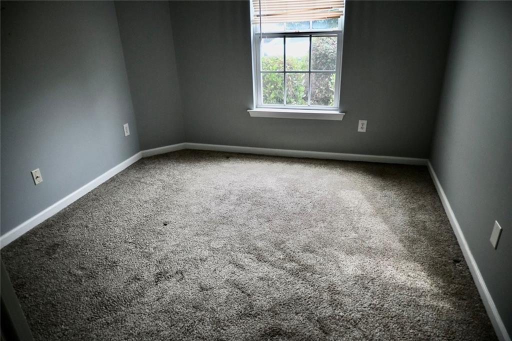 1563 Rachel's Ridge Northwest Kennesaw, GA 30152 - Photo 18 of 29 an empty room with a empty space and windows
