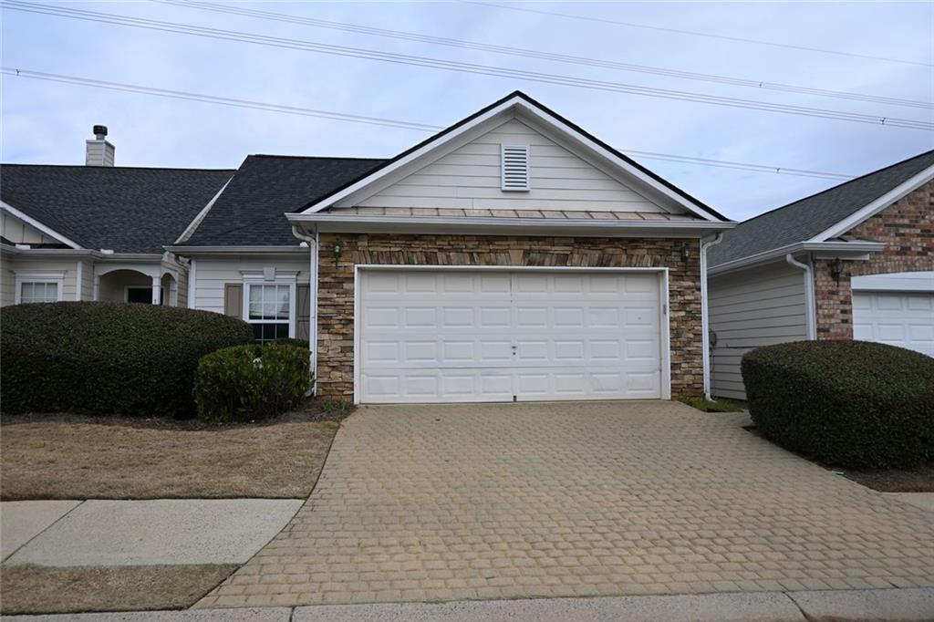 1563 Rachel's Ridge Northwest Kennesaw, GA 30152 - Photo 19 of 29 a front view of a house with a yard