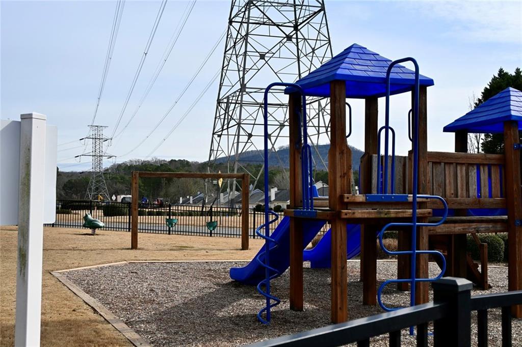 1563 Rachel's Ridge Northwest Kennesaw, GA 30152 - Photo 24 of 29 a view of dinning table and chairs in patio