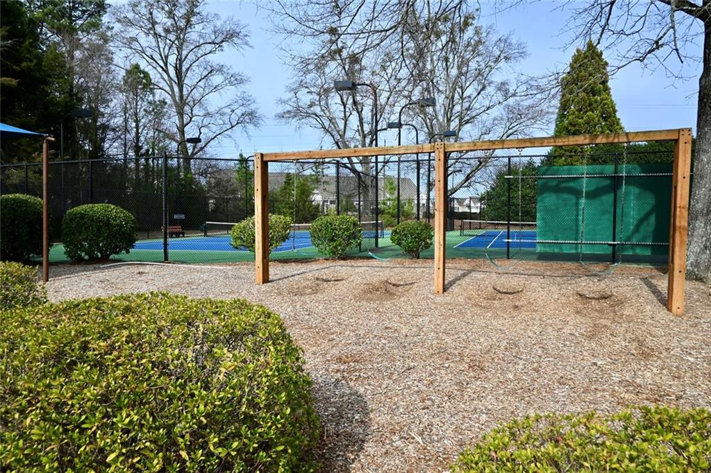 1563 Rachel's Ridge Northwest Kennesaw, GA 30152 - Photo 27 of 29 a view of a house with backyard and trees