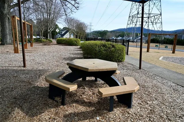 a view of a backyard with sitting area