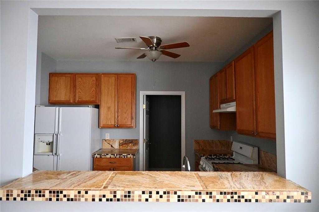 1563 Rachel's Ridge Northwest Kennesaw, GA 30152 - Photo 7 of 29 a bedroom with a bed and a view of kitchen