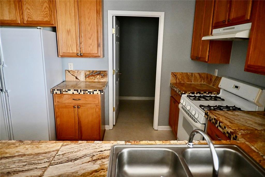 1563 Rachel's Ridge Northwest Kennesaw, GA 30152 - Photo 8 of 29 a bedroom with a bed and a dresser