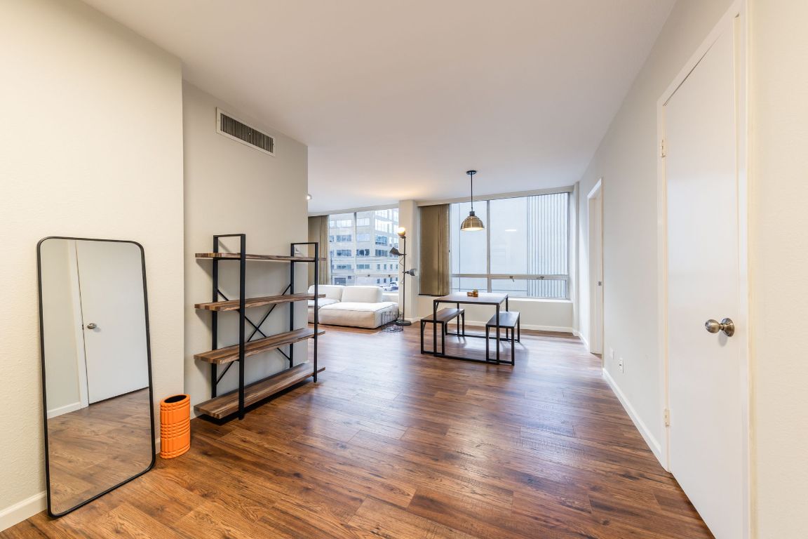 1212 Guadalupe Street, Unit 301 Austin, TX 78701 - Photo 4 of 28 a living room with furniture and a table