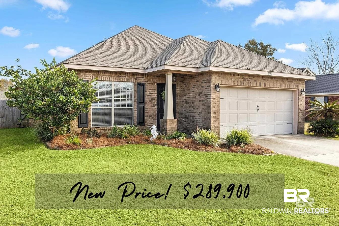 1752 Abbey Loop Foley, AL 36535 - Photo 1 of 21 View of front facade featuring brick siding, a shingled roof, concrete driveway, an attached garage, and a front yard