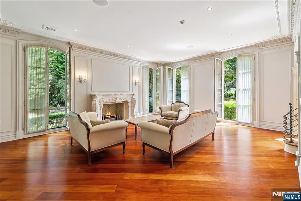 47 Fox Hedge Road Saddle River, NJ 07458 - Photo 5 of 22 a living room with fireplace furniture and a large window