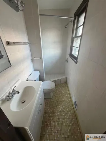 a view of a room with wooden floor and stairs