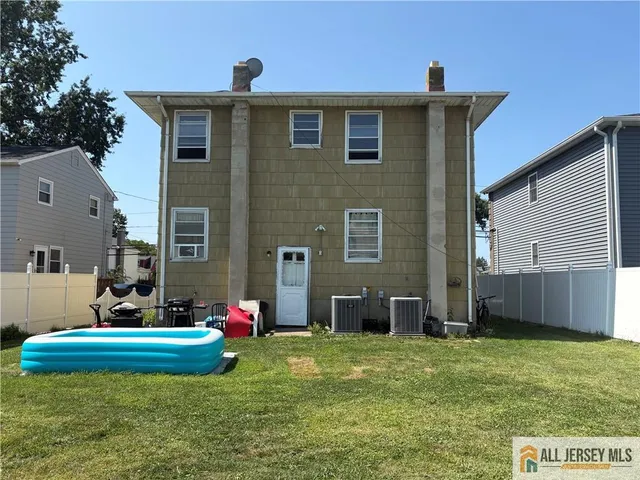 a view of city street with a car parked on the road
