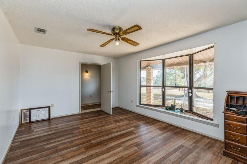 6246 Holloway Road Baker, FL 32531 - Photo 15 of 52 a view of a livingroom with a ceiling fan and window