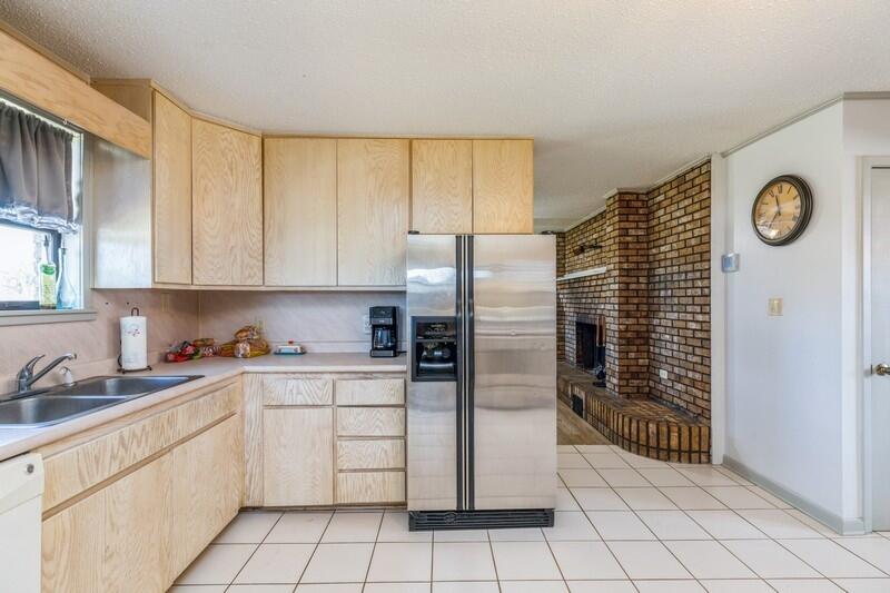 6246 Holloway Road Baker, FL 32531 - Photo 19 of 52 a kitchen with cabinets and a refrigerator