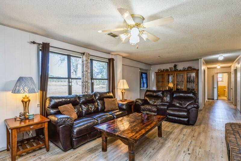 6246 Holloway Road Baker, FL 32531 - Photo 21 of 52 a living room with furniture and a large window