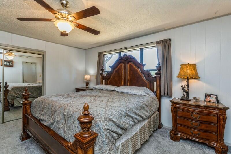 6246 Holloway Road Baker, FL 32531 - Photo 27 of 52 a bedroom with a bed and lamp