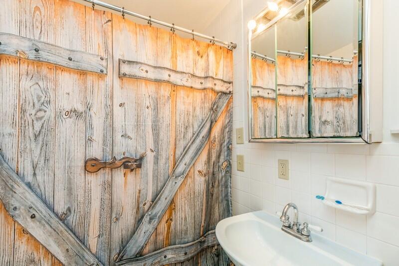 6246 Holloway Road Baker, FL 32531 - Photo 28 of 52 a bathroom with a sink and a mirror