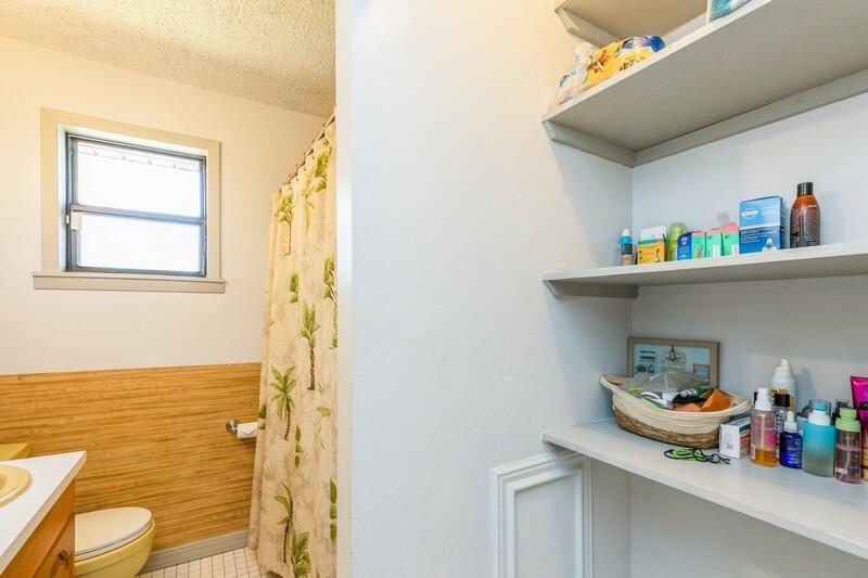 6246 Holloway Road Baker, FL 32531 - Photo 33 of 52 a bathroom with a sink a toilet and a shower curtain