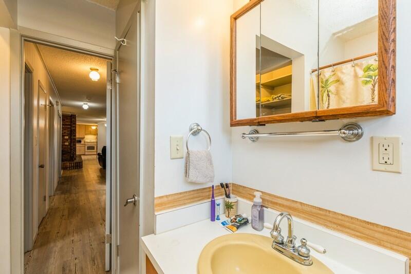 6246 Holloway Road Baker, FL 32531 - Photo 34 of 52 a bathroom with a granite countertop sink and a mirror