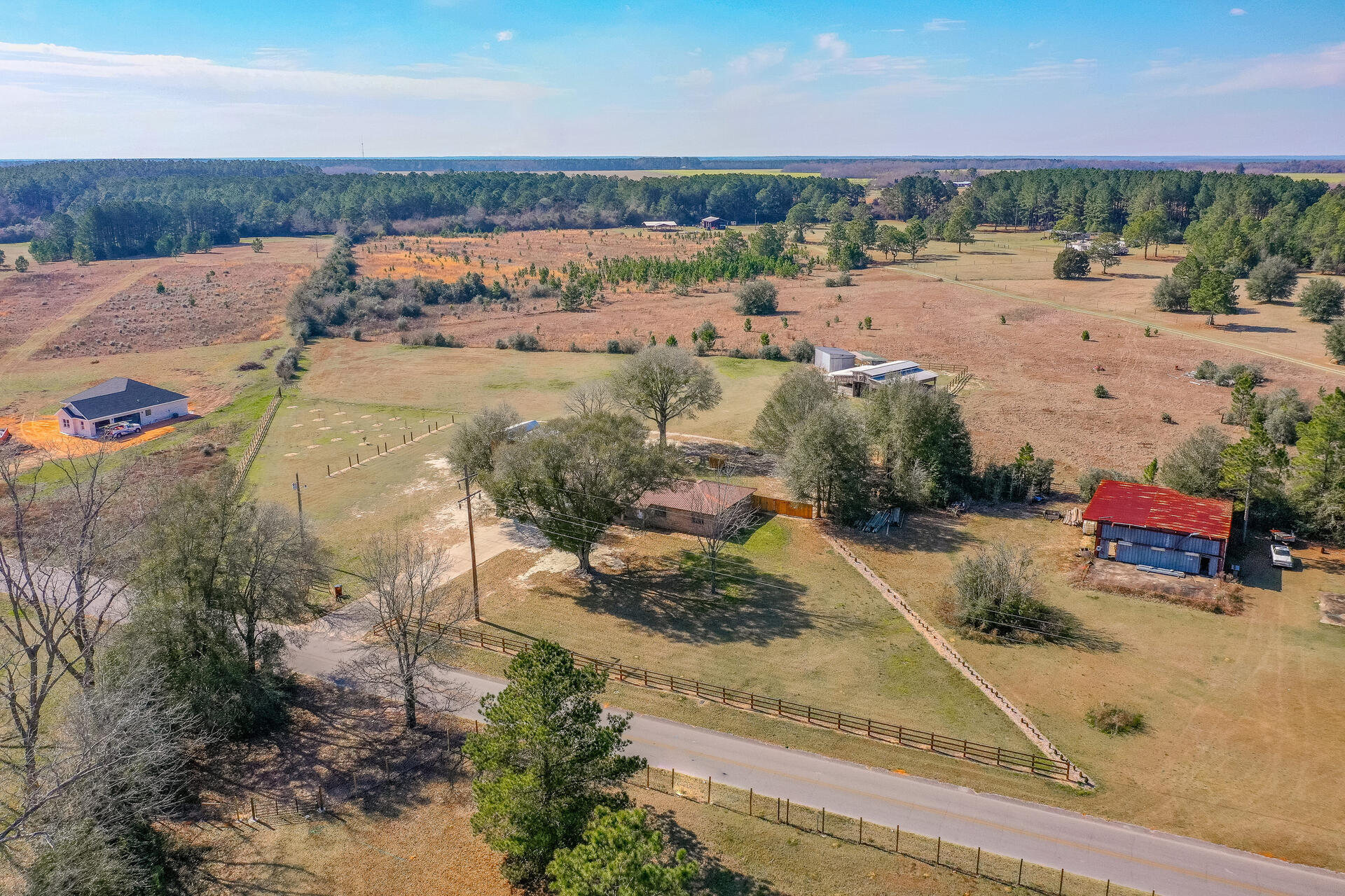 6246 Holloway Road Baker, FL 32531 - Photo 46 of 52 an aerial view of a house with a yard and lake view