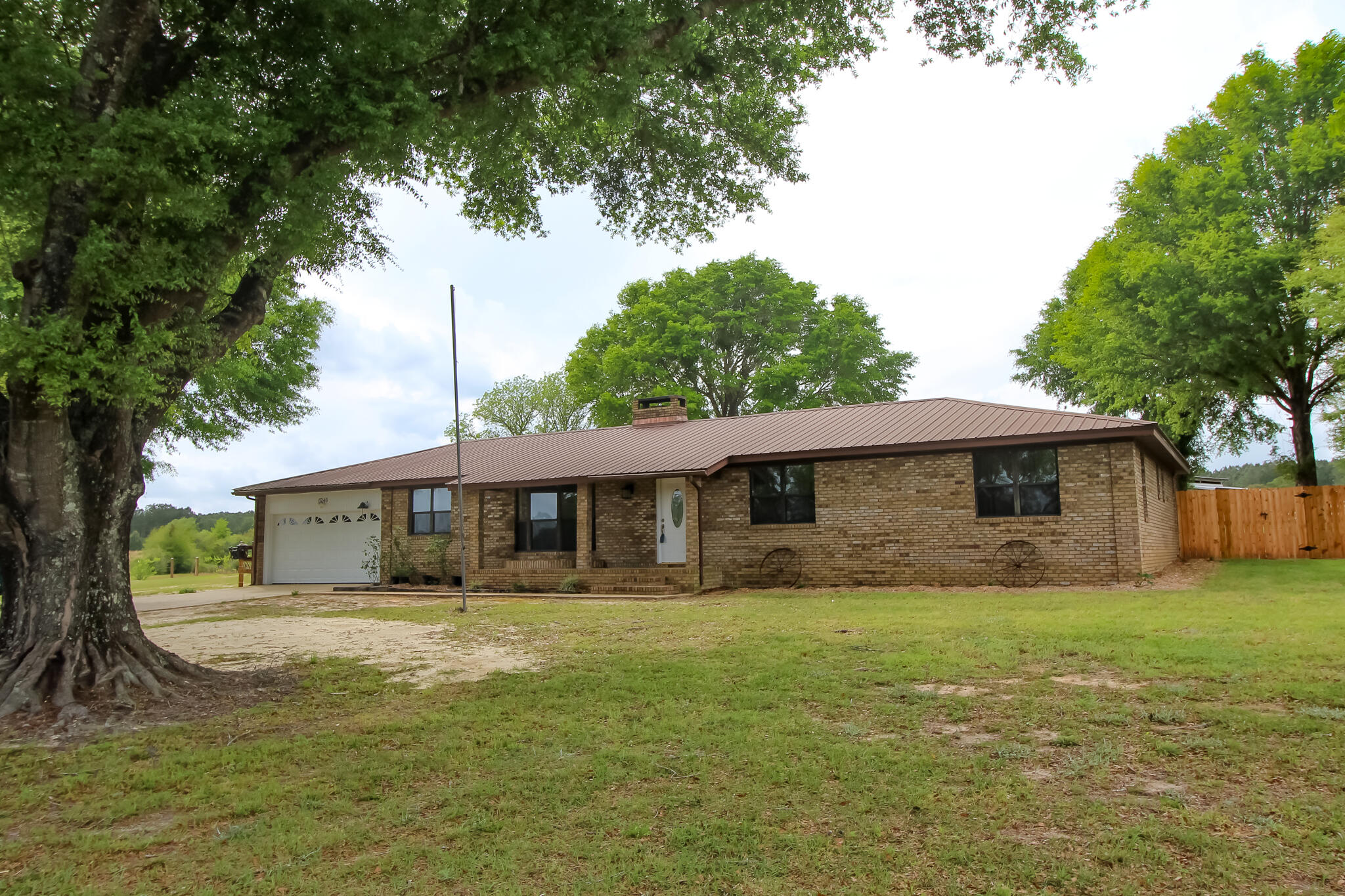 6246 Holloway Road Baker, FL 32531 - Photo 5 of 52 a front view of a house with garden